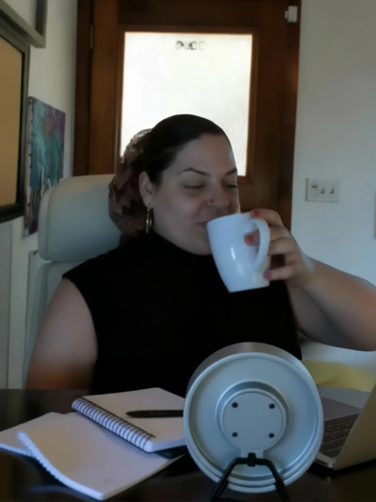 Avy sipping coffee
